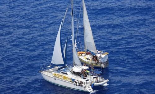 A photo of the two vessels taken on board a police helicopter in the Cayman Islands after the group was reported missing.