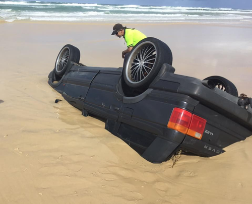 Incredibly, none of the car's occupants were injured when it rolled. (Queensland Ambulance Service)