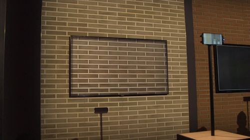 Using a combination of sensors and photos from your smartphone, the TV blends into your wall. (9NEWS)