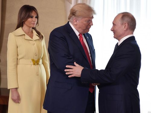 Melania Trump looks on as President Putin greets her husband.