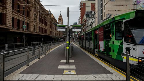 MELBOURNE, AUSTRALIA - JULY 16: A general view of an empty Flinders Street on July 16, 2021 in Melbourne, Australia. Lockdown restrictions have come into effect across Victoria as health authorities work to contain two COVID-19 outbreaks linked to Sydney's delta strain coronavirus cluster. The snap five-day lockdown, which came into effect at midnight on Thursday, was called after more new COVID-19 cases and exposure sites were confirmed across the state. Under the lockdown restrictions, Victori