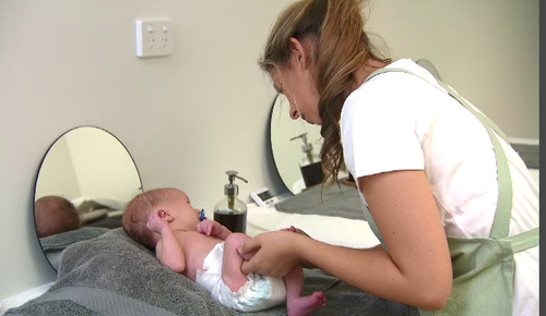 The babies get a foot massage after spending time in the neonatal pods. (9NEWS)