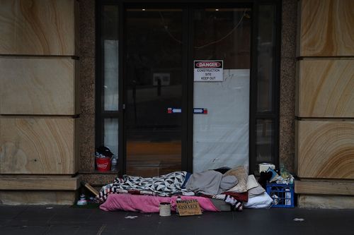 A homeless person sleeps in Sydney's CBD.