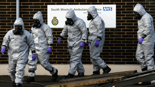 Military personnel donned gas masks after the suspected nerve gas attack in Salisbury, England. (AP)