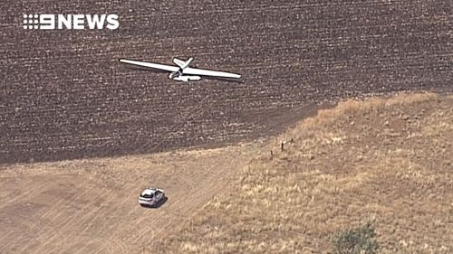 It's believed two men were killed in the crash as the plane tried to land. (9NEWS)