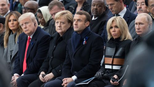 First lady Melania Trump, U.S. President Donald Trump, German Chancellor Angela Merkel, Emmanuel Macron and Brigitte Macron, Russian President Vladimir Putin attend a commemoration ceremony for Armistice Day.