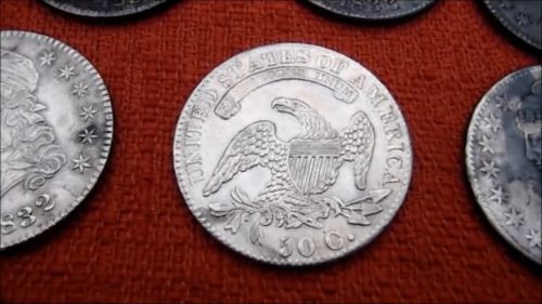 An antique silver coin. (YouTube/Aquachigger)