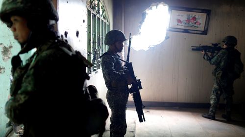 Members of the Philippine Marines 1st Brigade conduct a clearing operation at the main battle zone to liberate the ruined city from the presence of Daesh terrorists in Marawi City, Philippines on September 15, 2017.