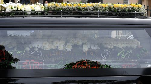 The coffin of the slain bikie boss leaves in a hearse. (AAP)