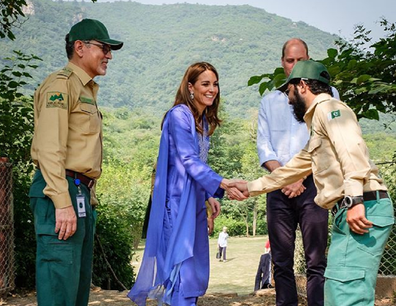 The soldier abandoned the salute to shake the Duchess' hand.