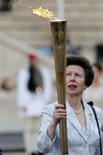 Princess Anne holds the Olympic torch at the Panathenaic stadium in Athens. 2012 Olympics.