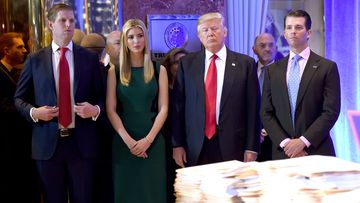 US President-elect Donald Trump along with his children Eric(L) Ivanka and Donald Jr. arrive for a press conference January 11, 2017 at Trump Tower in New York.