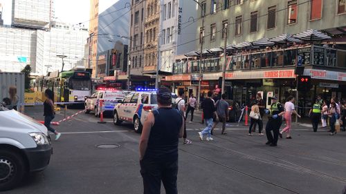 Police and paramedics at Flinders Street following the incident. (AAP)