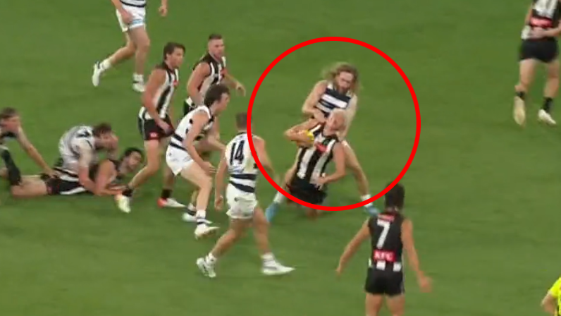 Collingwood&#x27;s Jack Ginnivan appears to stage for a free kick in a tackle by Geelong&#x27;s Cameron Guthrie.