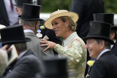 Zara Tindall, centre, speaks to Britain's King Charles III as they arrive for day one of the Royal Ascot horse racing meeting, at Ascot Racecourse in Ascot, England, Tuesday, June 20, 2023 
