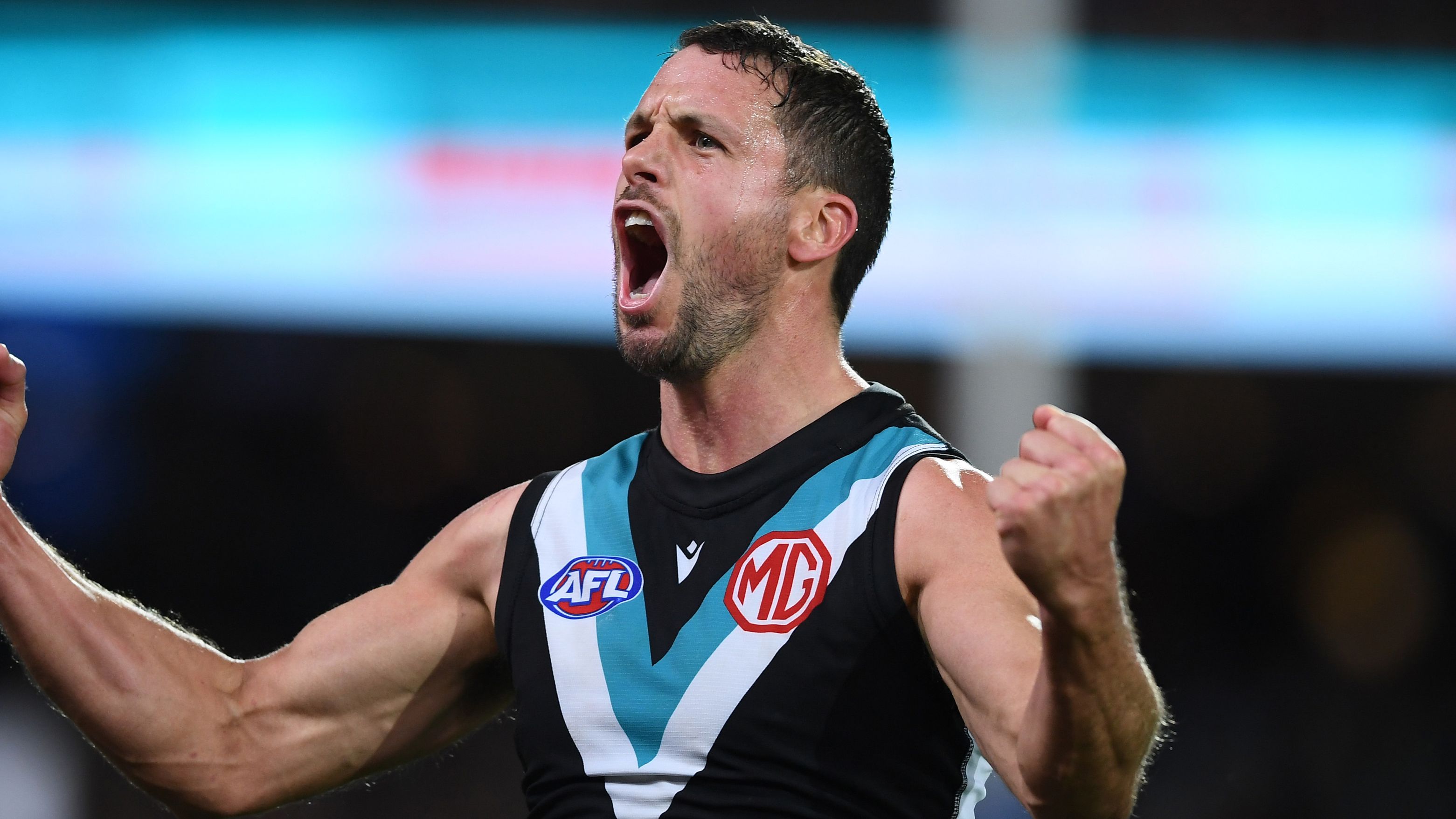 ADELAIDE, AUSTRALIA - MAY 06: Travis Boak of Port Adelaide   celebrates a goal during the round eight AFL match between the Port Adelaide Power and the Western Bulldogs at Adelaide Oval on May 06, 2022 in Adelaide, Australia. (Photo by Mark Brake/Getty Images)