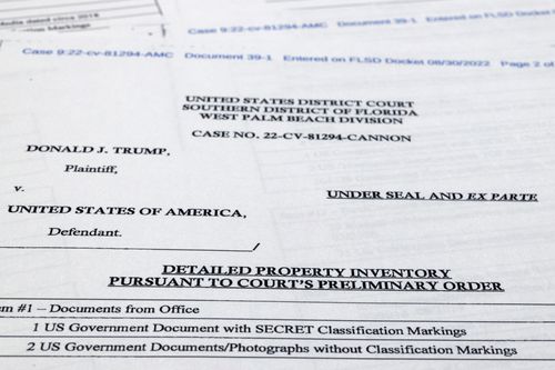 Pages from a FBI property list of items seized from former President Donald Trump's Mar-a-Lago estate and made public by the Department of Justice, are photographed September 2, 2022