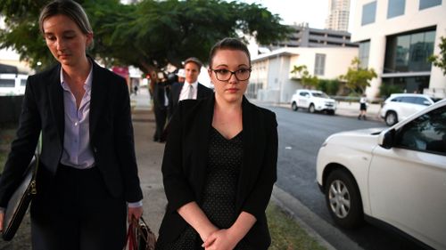 Thunder River Rapids ride operator Courtney Williams (right) leaves the inquest into the Dreamworld disaster at the Magistrates Court at Southport on the Gold Coast. Picture: AAP