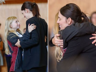 Jacinda Ardern embraces a student at Cashmere High School