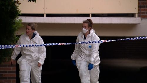 Forensic police at the Wentworthville unit.