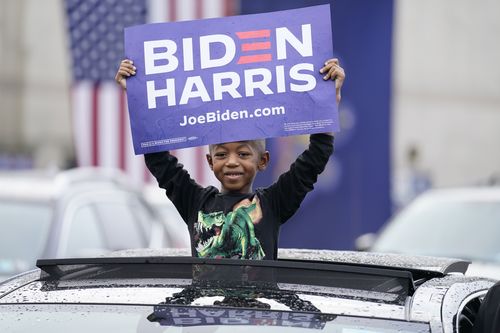 Supporters attend a "Souls to the Polls" drive-in rally for Democratic presidential candidate former Vice President Joe Biden, at Sharon Baptist Church