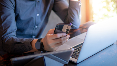 Man on phone and computer