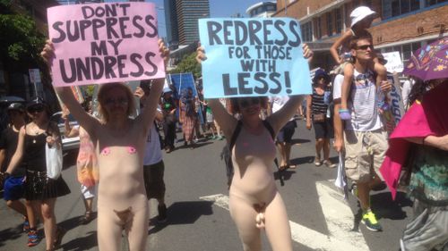 Near-nude protesters add some fake flesh to the G20 protests. (9NEWS)