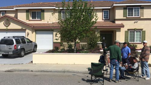 US media outside the outside the home of the YouTube shooter's parents in Menifee, California. (AP).