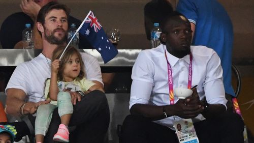 Australian Hollywood actor Chris Hemsworth and the world's fastest man Usain Bolt were seen together last night in the stands at the Commonwealth Games athletics events. Picture: AAP.