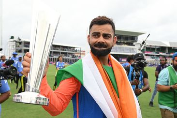 Virat Kohli holds the trophy during a lap of honour after India won the ICC Men&#x27;s T20 Cricket World Cup West Indies &amp; USA 2024 Final match between South Africa and India at Kensington Oval on June 29, 2024 in Bridgetown, Barbados. (Photo by Philip Brown/Getty Images)