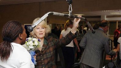 Camilla, Duchess of Cornwall watches pupils exercising during a tour of Copland Sports Centre at one of the country's top boarding schools, on January 30, 2006 in Westonbirt, England.