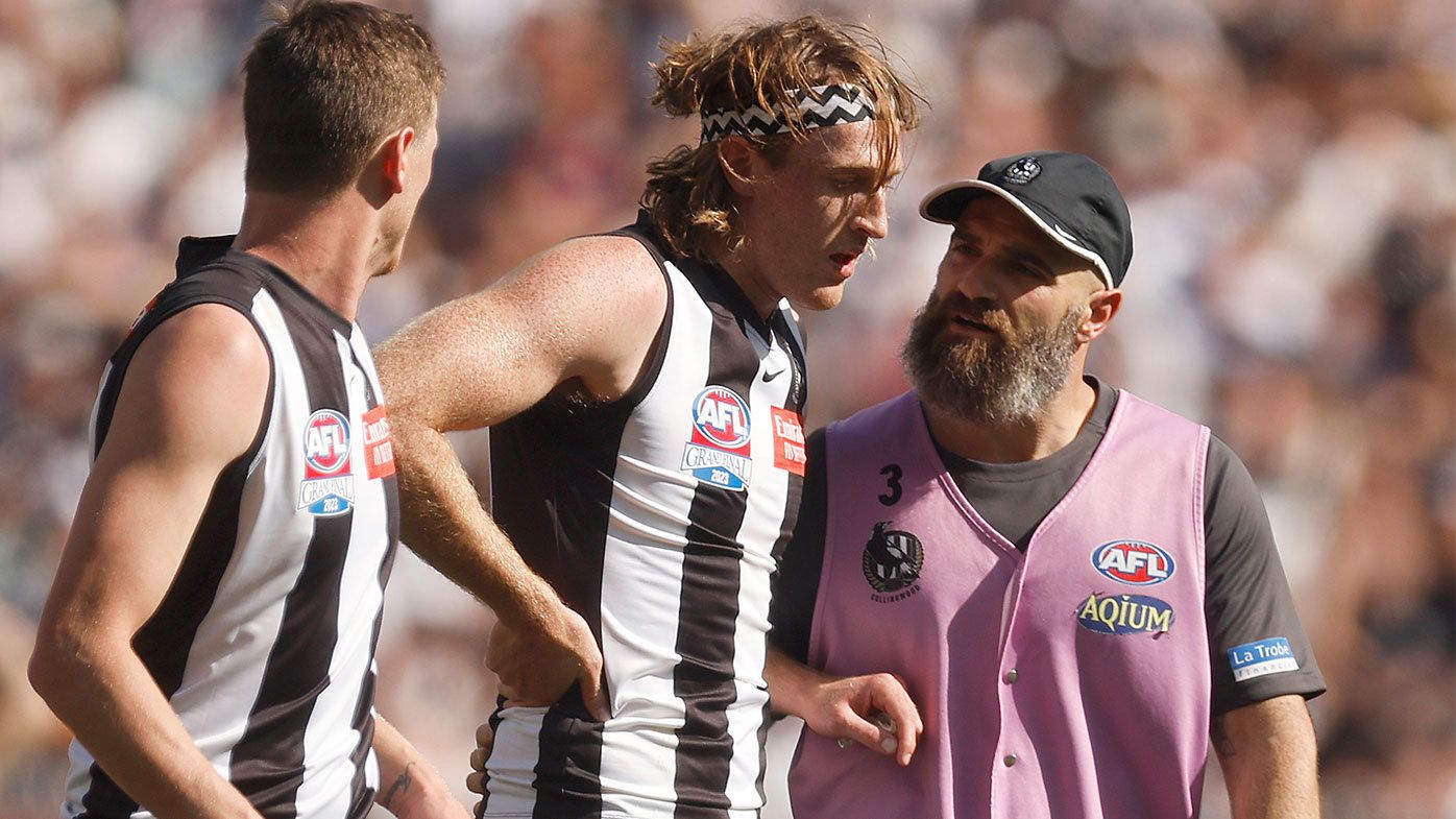 Nathan Murphy comes off the ground after suffering a concussion during the 2023 AFL grand final