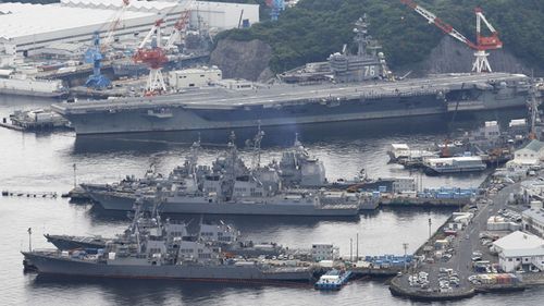 The nuclear-powered U.S. aircraft carrier Ronald Reagan (top) is seen in this photo taken from a Kyodo News helicopter on May 15, 2017, as it awaits deployment on a patrol mission from its home port in Yokosuka, southwest of Tokyo. 