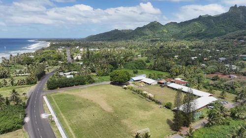 A NSW Central Coast couple has made an emotional journey to the Cook Islands, delivering more than one thousand pieces of football gear to sports teams and schools. Die-hard mariners fans Sharon Pascoe and Wayne Parrott visited the Cook Island capital of Rarotonga in October last year where they saw young children playing barefoot and sharing in a local soccer competition. Nearly 600 pairs of football boots were donated by local families as well as other football gear.