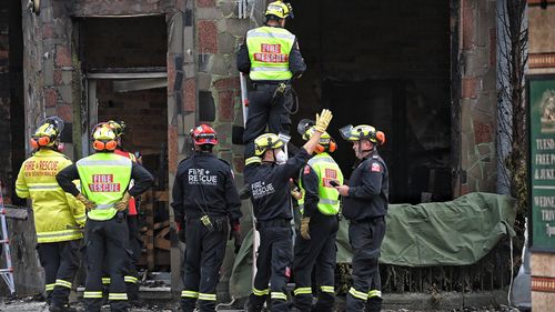 Fire and Rescue and Police investigate the fire which killed at least three people in Newtown, Sydney.