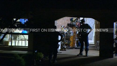 Police also raided a home in Bonny Hills. (9NEWS)