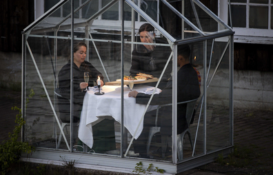 Dinner is served during a test evening in so-called quarantine greenhouses in Amsterdam, The Netherlands