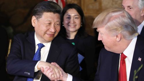 Xi Jinping shakes hands with Donald Trump. (AAP)