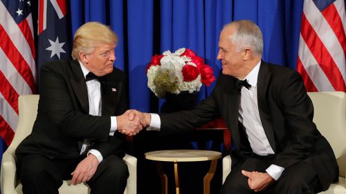 President Donald Trump and Australian Prime Minister Malcolm Turnbull shake hands during their meeting aboard the USS Intrepid. (AAP)