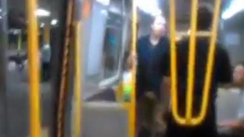 One of the passengers stands up to the attacker's racist tirade. (YouTube)