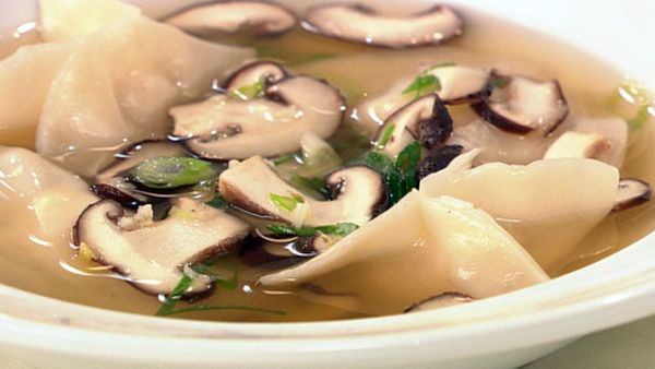 Chicken and prawn dumplings in chicken broth with shitake mushrooms and spring onion