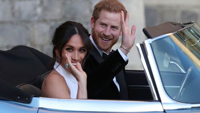 FILE - In this Saturday, May 19, 2018 file photo the newly married Duke and Duchess of Sussex, Meghan Markle and Prince Harry, leave Windsor Castle in a convertible car after their wedding in Windsor, England, to attend an evening reception at Frogmore House, hosted by the Prince of Wales. Prince Harry and his wife Meghan are ending their lives as senior members of Britains royal family and starting an uncertain new chapter as international celebrities and charity patrons. In January the couple 