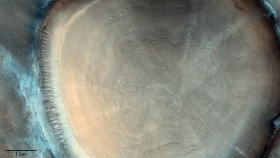 'Tree trunk' crater snapped on Mars. Patterns inside this ice-rich crater reveal details of Mars history