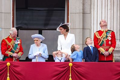(LR) Prince Charles, Prince of Wales, Queen Elizabeth II, Prince Louis of Cambridge, Catherine, Duchess of Cambridge, Princess Charlotte of Cambridge, Prince George of Cambridge and Prince William, Duke of Cambridge watch the RAF flypast on Buckingham Palace Trooping the Color parade June 02, 2022 in London, England.  