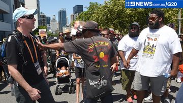 Protesters calling for better recognition of indigenous rights marched outside the G20 convention centre today. (AAP)