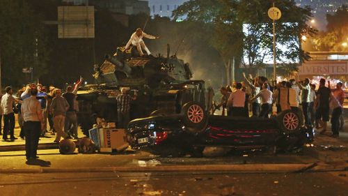 Citizens take the fight back to the military faction behind the coup in Ankara. (AAP)