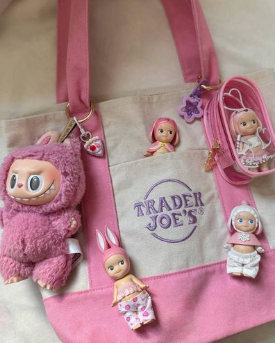 Sonny Angels and Labubu hanging on a bag