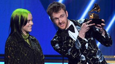 Billie Eilish and Finneas O'Connell accept the Song of the Year award for 'Bad Guy' onstage during the 62nd Annual GRAMMY Awards.