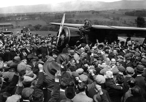 A crowd cheers for aviatrix Amelia Earhart as she boards her single-engine Lockheed Vega airplane in Londonderry, Northern Ireland, for the trip back to London on May 22, 1932. Earhart became the first woman to fly solo nonstop across the Atlantic Ocean when she finished her 3260km journey on May 21, 1932 in under 15 hours after departing from Harbour Grace, Newfoundland. Earhart vanished mysteriously over the Pacific during her attempted round-the-world flight in 1937. 