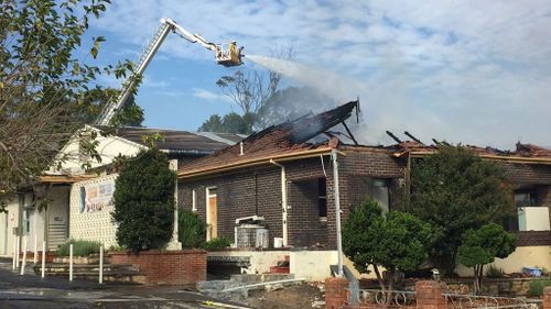 Fire crews contained the building fire just before 10.30am. (Twitter/FRNSW)